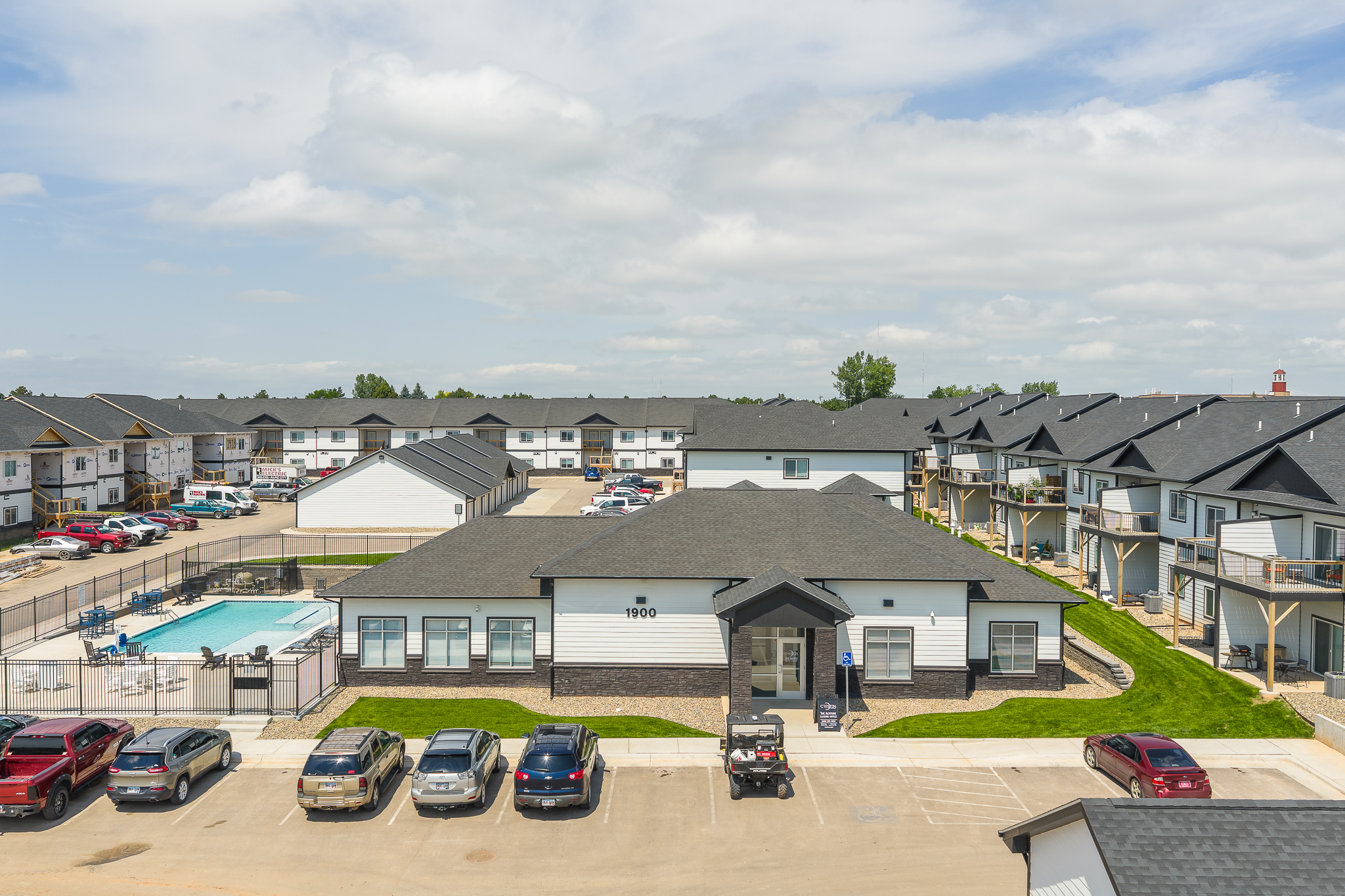 City's Edge residential - building exterior, bathroom, and kitchen/living room